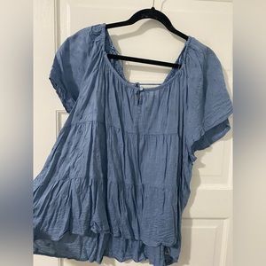 Dusty blue tiered embroidered shirt with fun back cut out